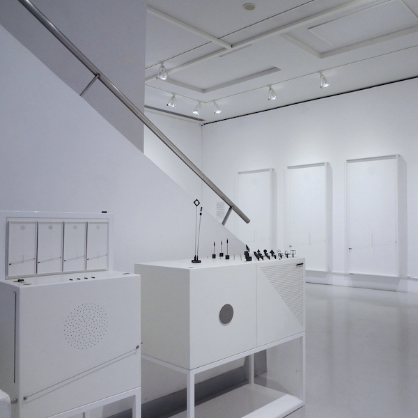 Photo view of the exhibition Takis energy Spaces. At the front appear the museum educational boxes created by Katerina Bakaliou for the interpretation of the artworks by the artist takis. at the back appear the artworks Musical by the artist Takis at MOMus Museum Alex Mylona