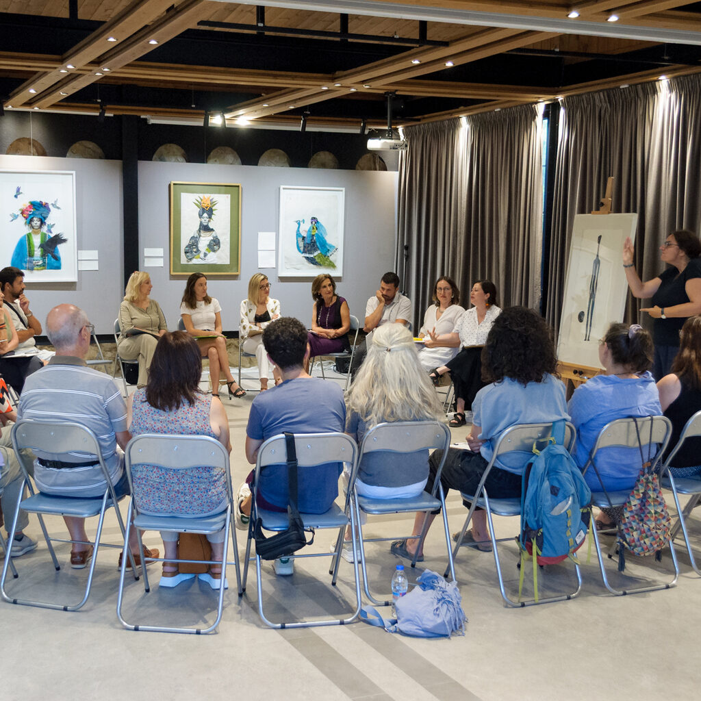 Large circle of participants in an Heraklion art gallery's space
