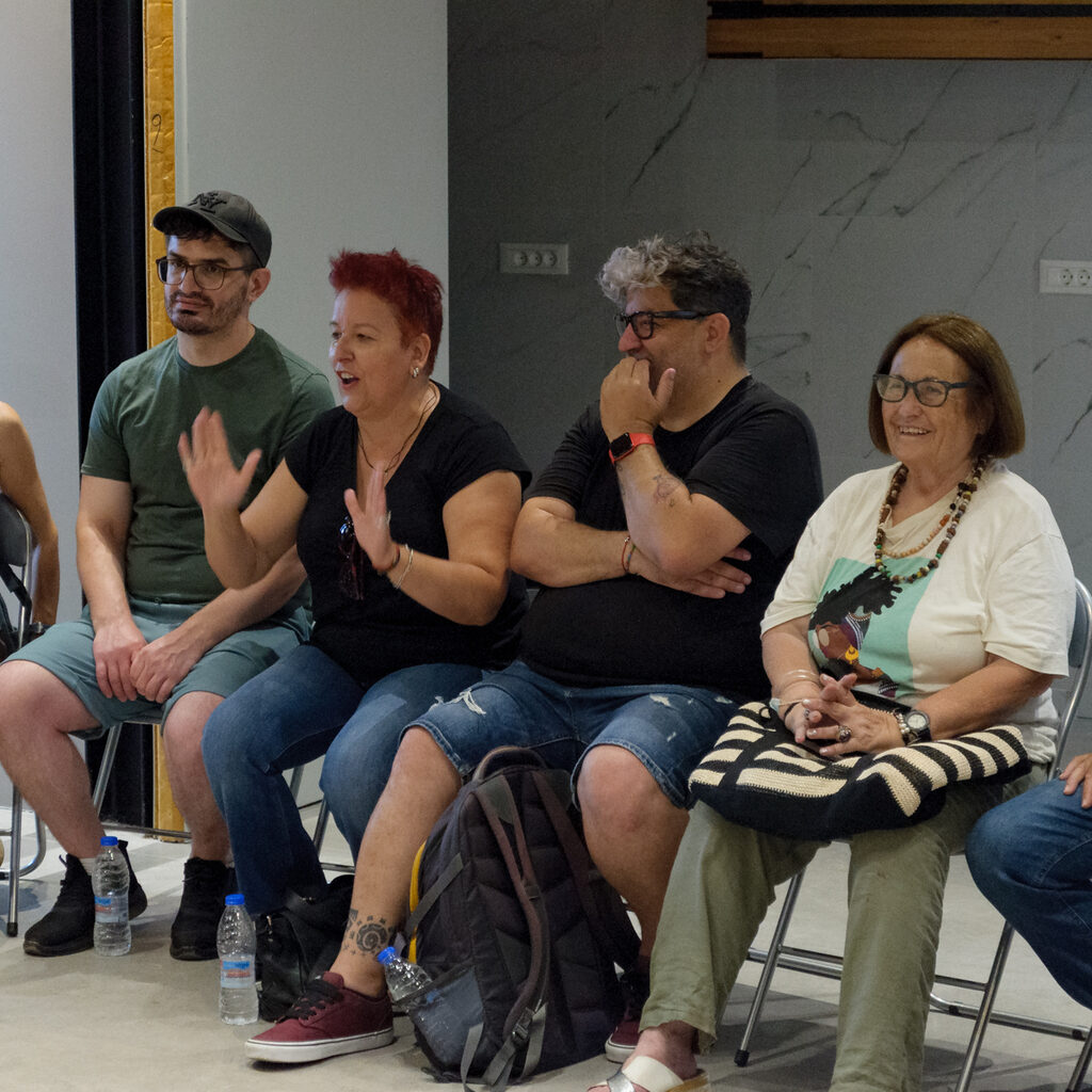 Participants talking while seated in a circle