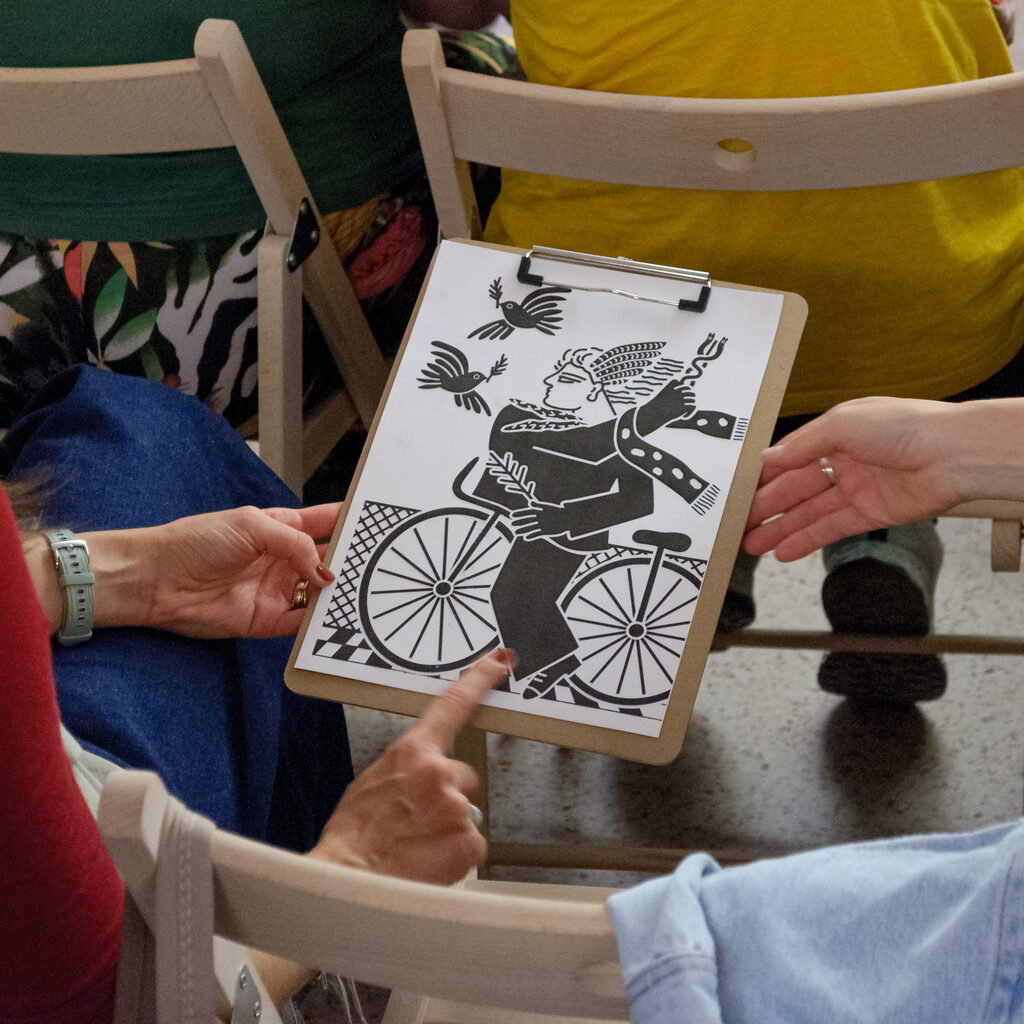 Two people touching the tactile representation of the painting