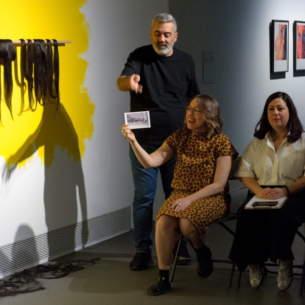 Postcards collection presentation in front of the artwork