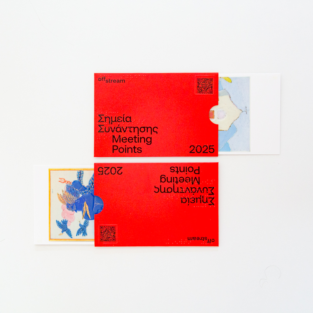 Two red envelopes containing two of the Meeting Points 2025 inclusive postcards.