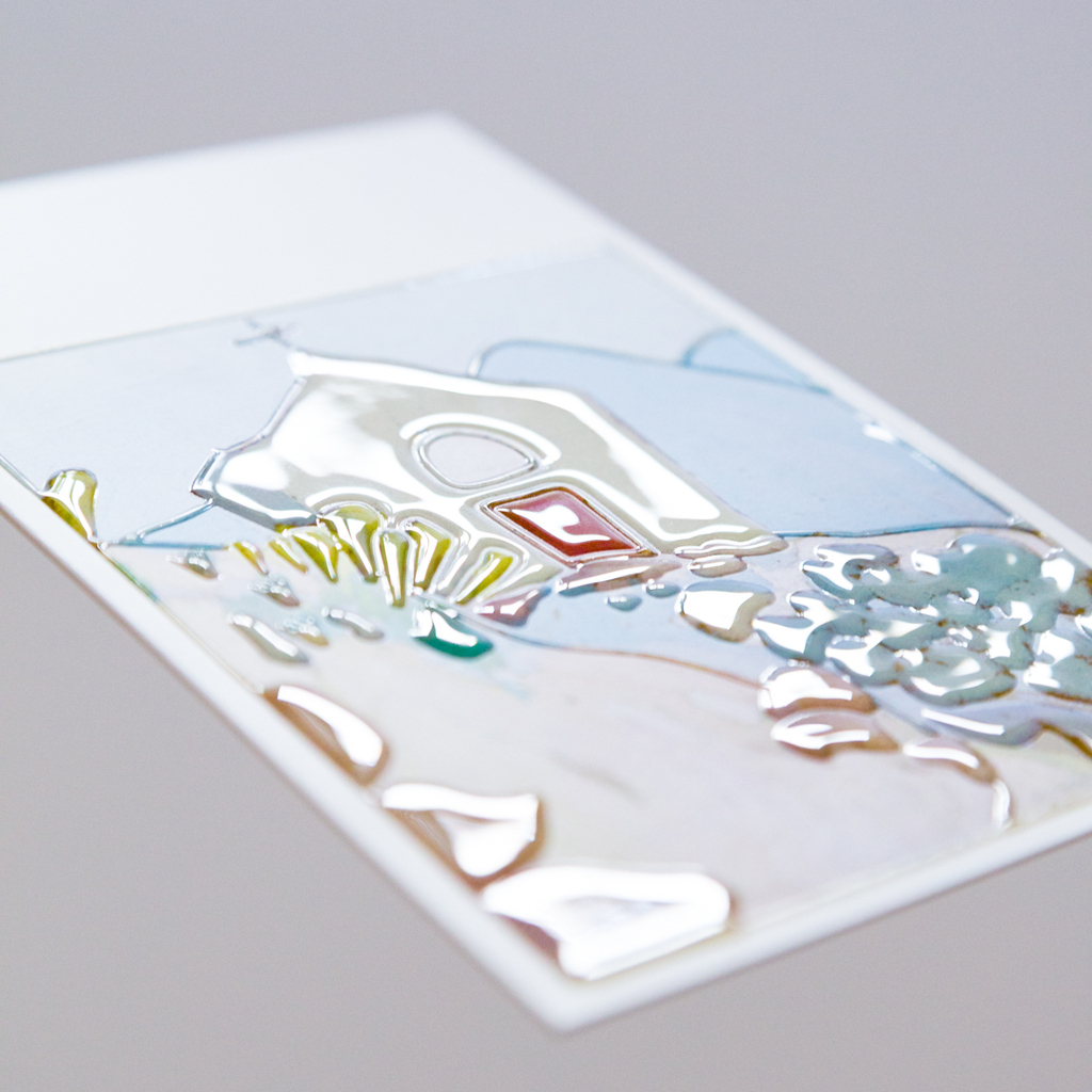Close-up of an artwork on a postcard, shown in photographic and transparent tactile form.